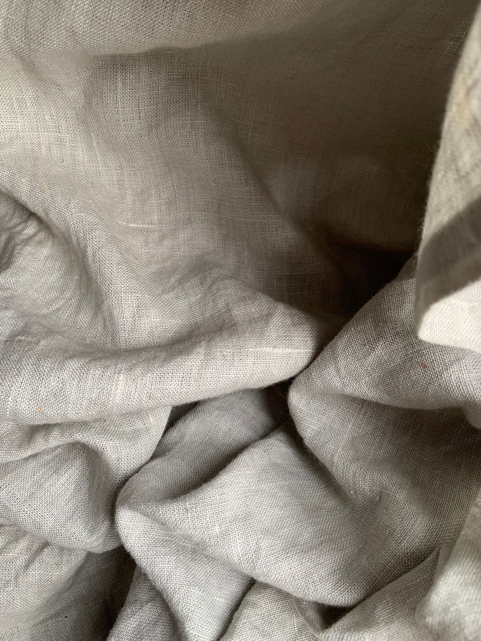 Close detail of softly folded natural linen