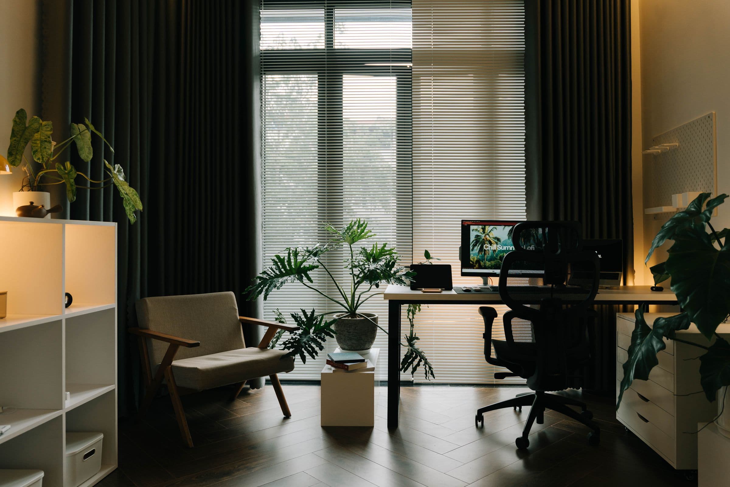 Warm contemporary home workspace with plants and natural materials